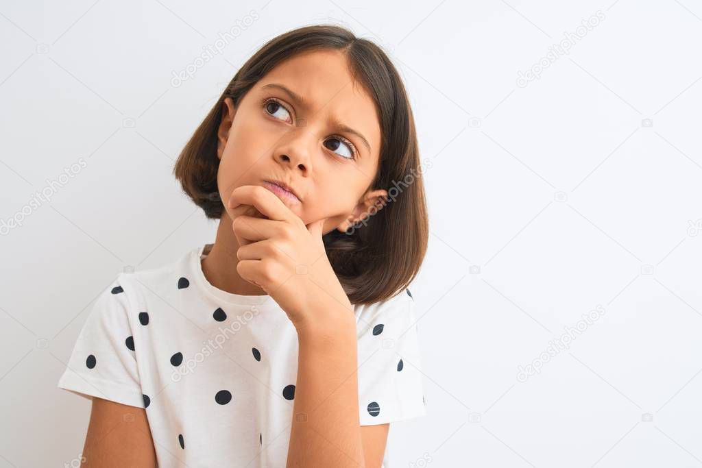 Young beautiful child girl wearing casual t-shirt standing over isolated white background serious face thinking about question, very confused idea