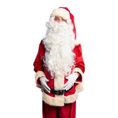 Orta yaşlı yakışıklı adam, Noel Baba kostümü ve sakal takmış kameraya bakıyor. Havada öpücük yolluyor. Güzel ve seksi. Aşk ifadesi.