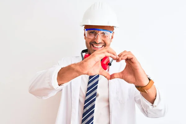 Młody Chemik Kasku Słuchawkach Odosobnionym Tle Uśmiechnięty Miłością Symbolami Serca — Zdjęcie stockowe