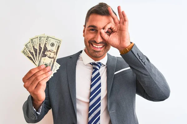 Joven Hombre Negocios Guapo Sosteniendo Montón Billetes Dólares Sobre Fondo —  Fotos de Stock