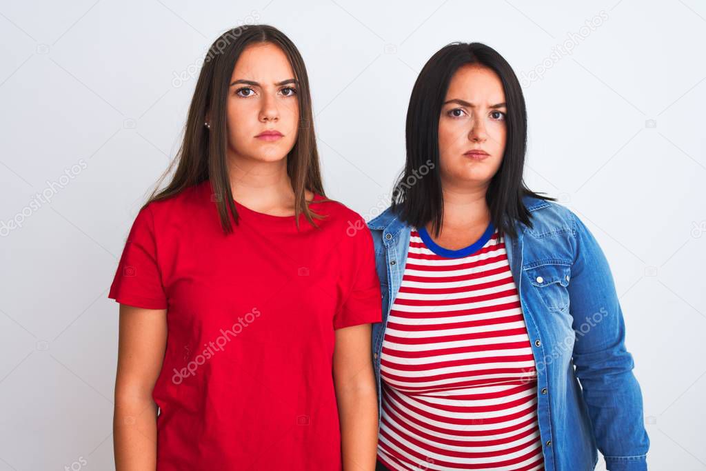 Young beautiful women wearing casual clothes standing over isolated white background skeptic and nervous, frowning upset because of problem. Negative person.