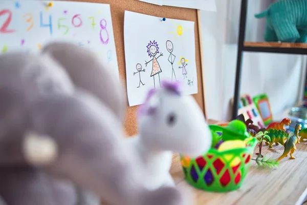 Beautiful games corner with lots of toys and draws at kindergarten