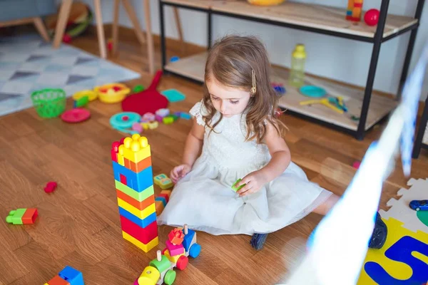 Adorable Blonde Toddler Playing Building Blocks Lots Toys Kindergarten — Stock Photo, Image