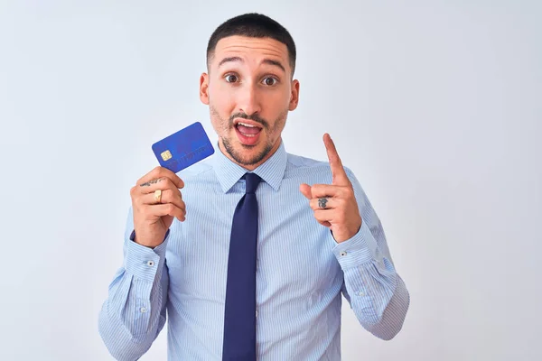 Young Business Man Holding Credit Card Isolated Background Surprised Idea — Stock Photo, Image