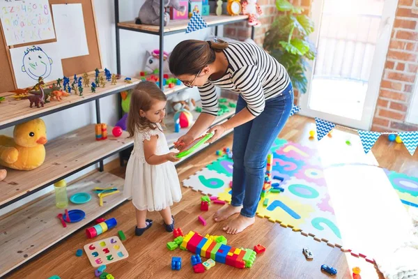 Beautiful Teacher Woman Toddler Drawing Digital Board Lots Toys Kindergarten — Stock Photo, Image