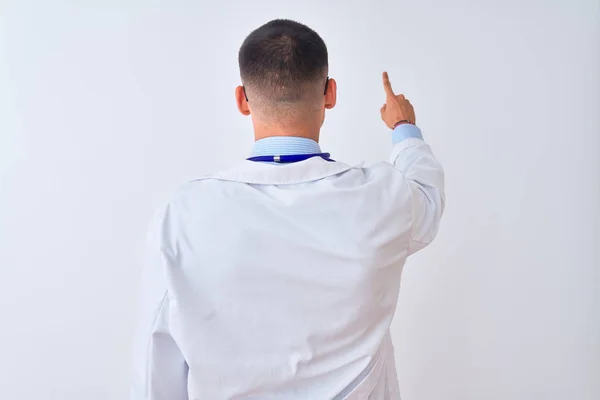 Young Doctor Man Wearing Stethoscope Isolated Background Posing Backwards Pointing — Stock Photo, Image