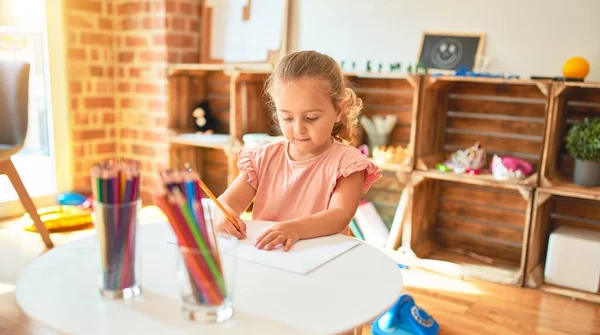 Beautiful Blond Toddler Girl Drawing Colored Pencils Kindergarten — ストック写真