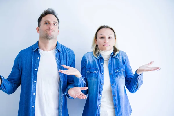 Young Beautiful Couple Wearing Denim Shirt Standing Isolated White Background — 스톡 사진