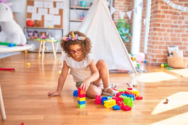 Beautiful Toddler Wearing Glasses Unicorn Diadem Sitting Playing Building Blocks — Stock Photo, Image