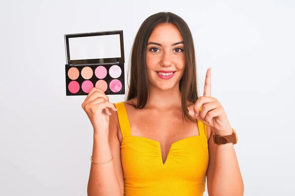 Young Beautiful Girl Holding Makeup Standing Isolated White Background Surprised — 스톡 사진