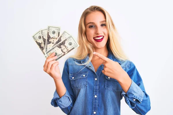 Young Beautiful Blond Woman Holding Dollars Standing Isolated White Background — 스톡 사진