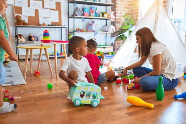 Young Beautiful Teacher Toddlers Playing Lots Toys Kindergarten — Stock Photo, Image