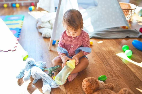 Adorable Toddler Holding Feeding Bottle Lots Toys Kindergarten — Stock Photo, Image
