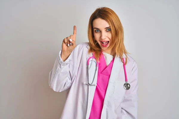 Redhead Caucasian Doctor Woman Wearing Pink Stethoscope Isolated Background Pointing — Stok fotoğraf