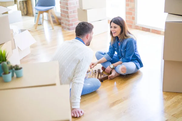 Young Beautiful Couple Playing Chess New Home Cardboard Boxes — Stock Photo, Image