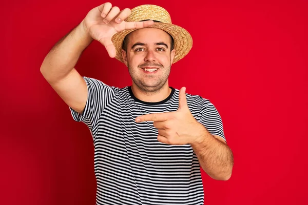 Young Man Wearing Striped Navy Shirt Hat Standing Isolated Red — Stockfoto