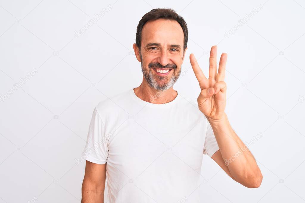 Middle age handsome man wearing casual t-shirt standing over isolated white background showing and pointing up with fingers number three while smiling confident and happy.