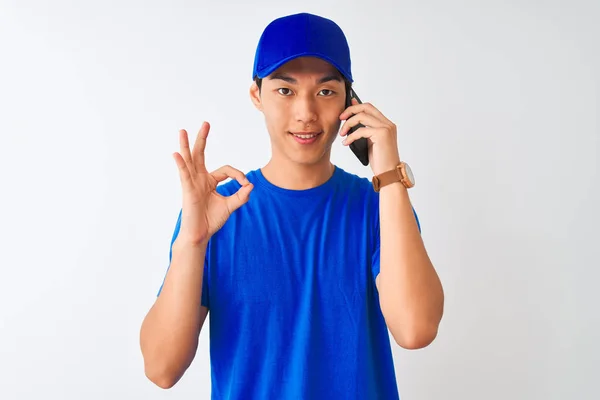 Chinese Deliveryman Wearing Cap Talking Smartphone Isolated White Background Doing — 스톡 사진