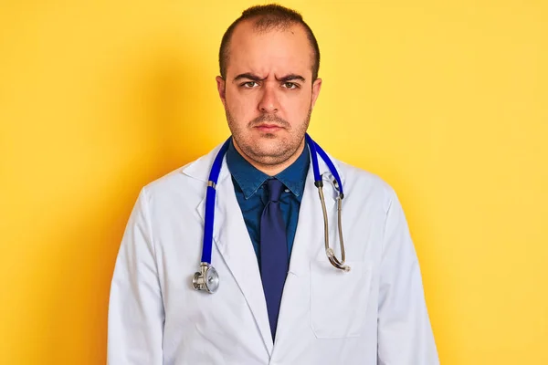 Young Doctor Man Wearing Coat Stethoscope Standing Isolated Yellow Background — Stok fotoğraf