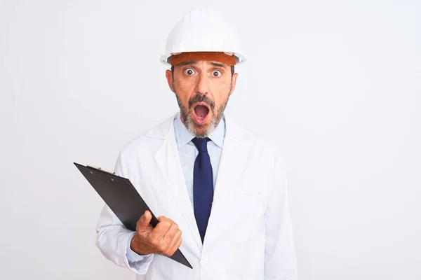 Senior Engineer Man Wearing Security Helmet Holding Clipboard Isolated White — 스톡 사진