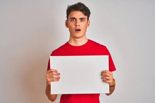 Teenager Boy Holding Advertising Banner Blank Space Isolated Background Scared — 스톡 사진