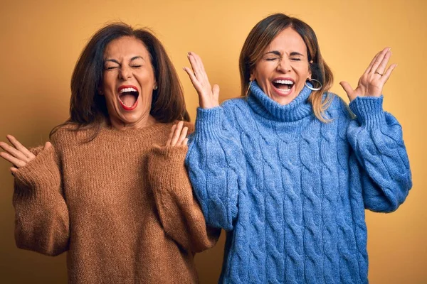 Middle Age Beautiful Couple Sisters Wearing Casual Sweater Isolated Yellow — 스톡 사진