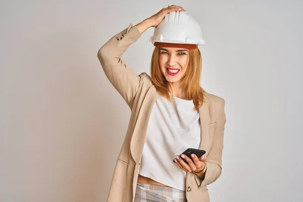 Young Caucasian Engineer Woman Using Smartphone Wearing Safety Helmet Stressed — 图库照片