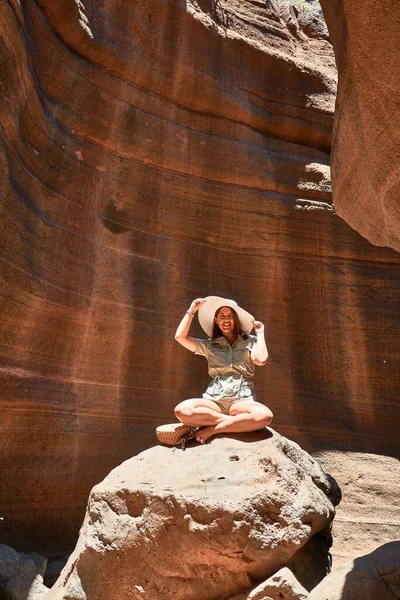 Young beauitufl hiker woman trekking natural orange mountain on summer holidays