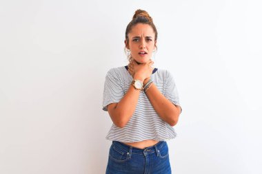 Young redhead modern woman wearing a bun over isolated background shouting and suffocate because painful strangle. Health problem. Asphyxiate and suicide concept.
