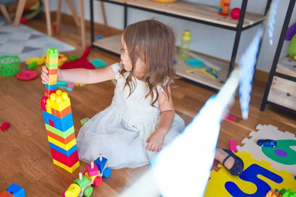Adorable Blonde Toddler Playing Building Blocks Lots Toys Kindergarten — ストック写真
