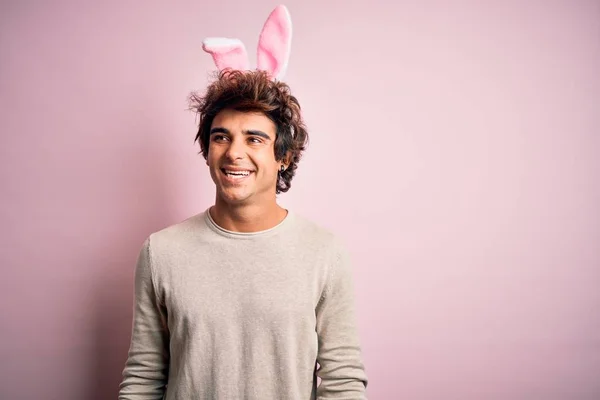 Young Handsome Man Holding Easter Rabbit Ears Standing Isolated Pink — Stockfoto