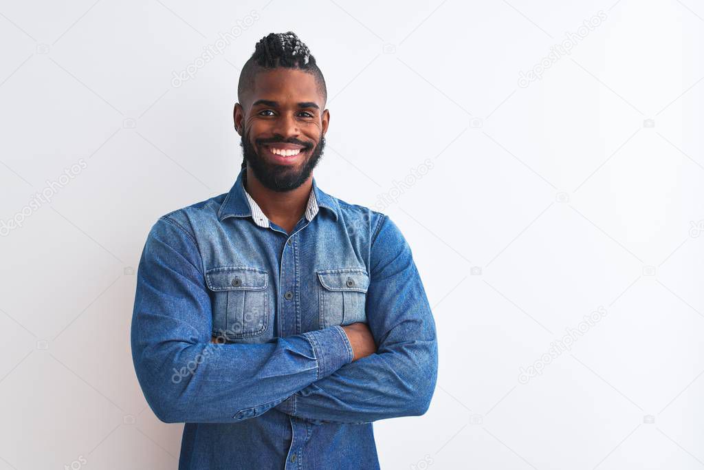African american man with braids wearing denim shirt over isolated white background happy face smiling with crossed arms looking at the camera. Positive person.