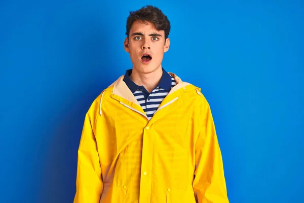 Teenager Fisherman Boy Wearing Yellow Raincoat Isolated Background Afraid Shocked — ストック写真