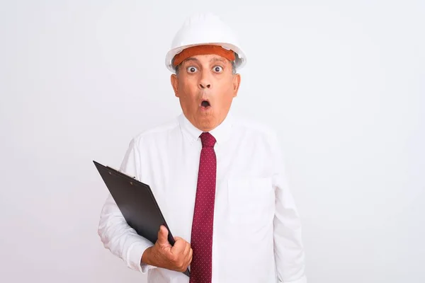 Senior Architect Man Wearing Security Helmet Holding Clipboard Isolated White — 스톡 사진