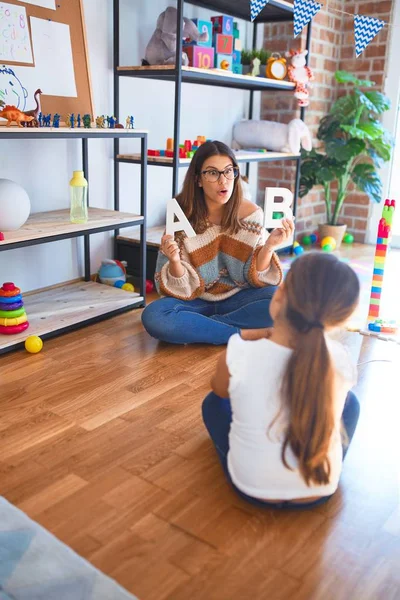 Beautiful Teacher Teaching Toddler Alphabet Lots Toys Kindergarten — Stock Photo, Image