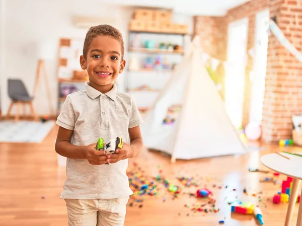 Beautiful African American Toddler Holding Cars Toy Smiling Lots Toys — Stockfoto