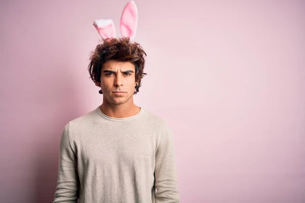 Young Handsome Man Holding Easter Rabbit Ears Standing Isolated Pink — Stockfoto