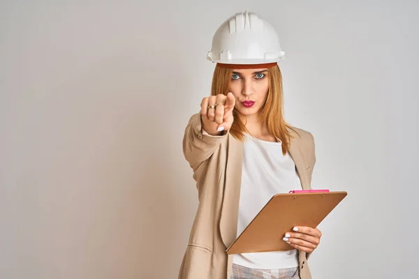 Redhead Caucasian Business Woman Wearing Safety Helmet Holding Clipboard Pointing — Stok fotoğraf