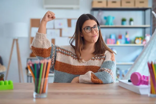 Young Beautiful Teacher Woman Wearing Sweater Glasses Sitting Desk Kindergarten — Stok Foto