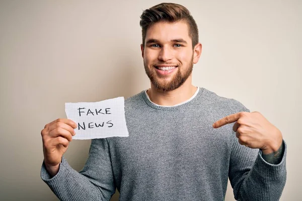 Young Blond Man Beard Blue Eyes Holding Paper Fake News — 스톡 사진