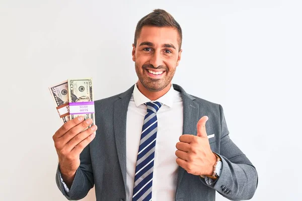Νεαρός Όμορφος Επιχειρηματίας Που Κρατάει Χαρτονομίσματα Πάνω Από Απομονωμένο Φόντο — Φωτογραφία Αρχείου