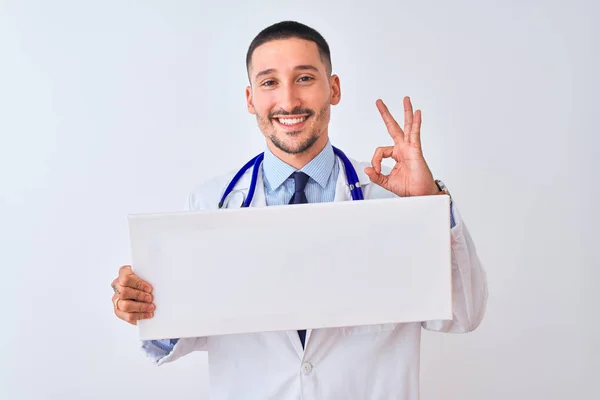 Young Doctor Man Holding Blank Advertising Banner Isolated Background Doing — Stockfoto