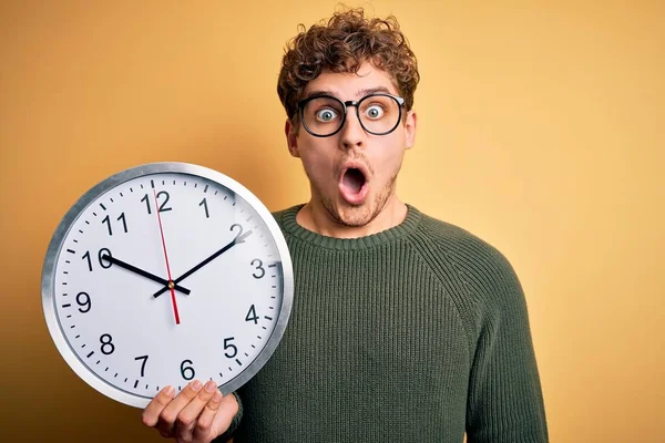 Young Blond Man Curly Hair Wearing Glasses Holding Big Clock — 스톡 사진