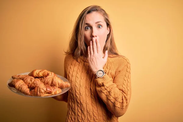 Young Beautiful Blonde Woman Holding Plate Croissants Isolated Yellow Background — Stock Photo, Image