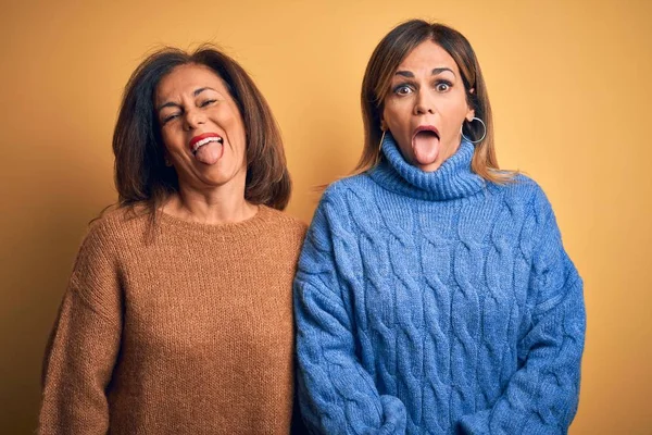 Middle Age Beautiful Couple Sisters Wearing Casual Sweater Isolated Yellow — Stock Photo, Image