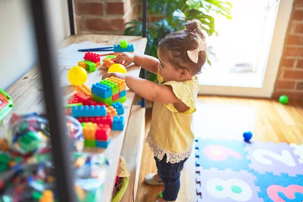 Beautiful Toddler Standing Taking Toys Shelving Kindergarten — Stock Photo, Image