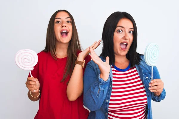 Young Beautiful Women Holding Sweet Lollipop Standing Isolated White Background — Stock Photo, Image