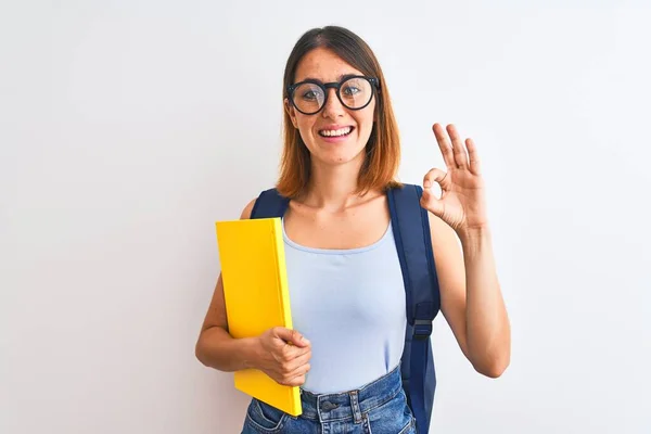 Beautiful Redhead Student Woman Wearing Backpack Book Doing Sign Fingers — 스톡 사진