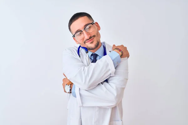 Young Doctor Man Wearing Stethoscope Isolated Background Hugging Oneself Happy — Stok fotoğraf