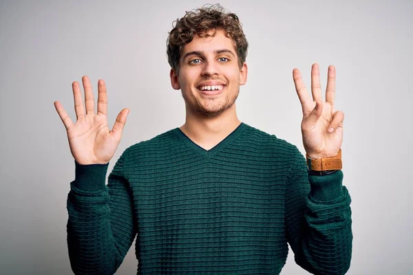 Young Blond Handsome Man Curly Hair Wearing Green Sweater White — 스톡 사진